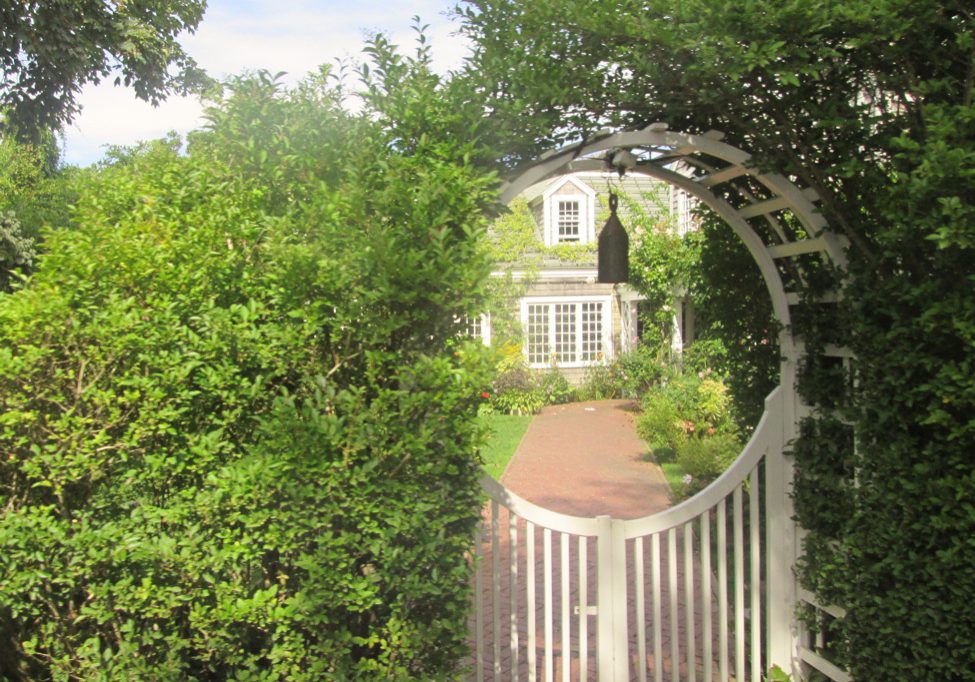 Nantucket house through the fence
